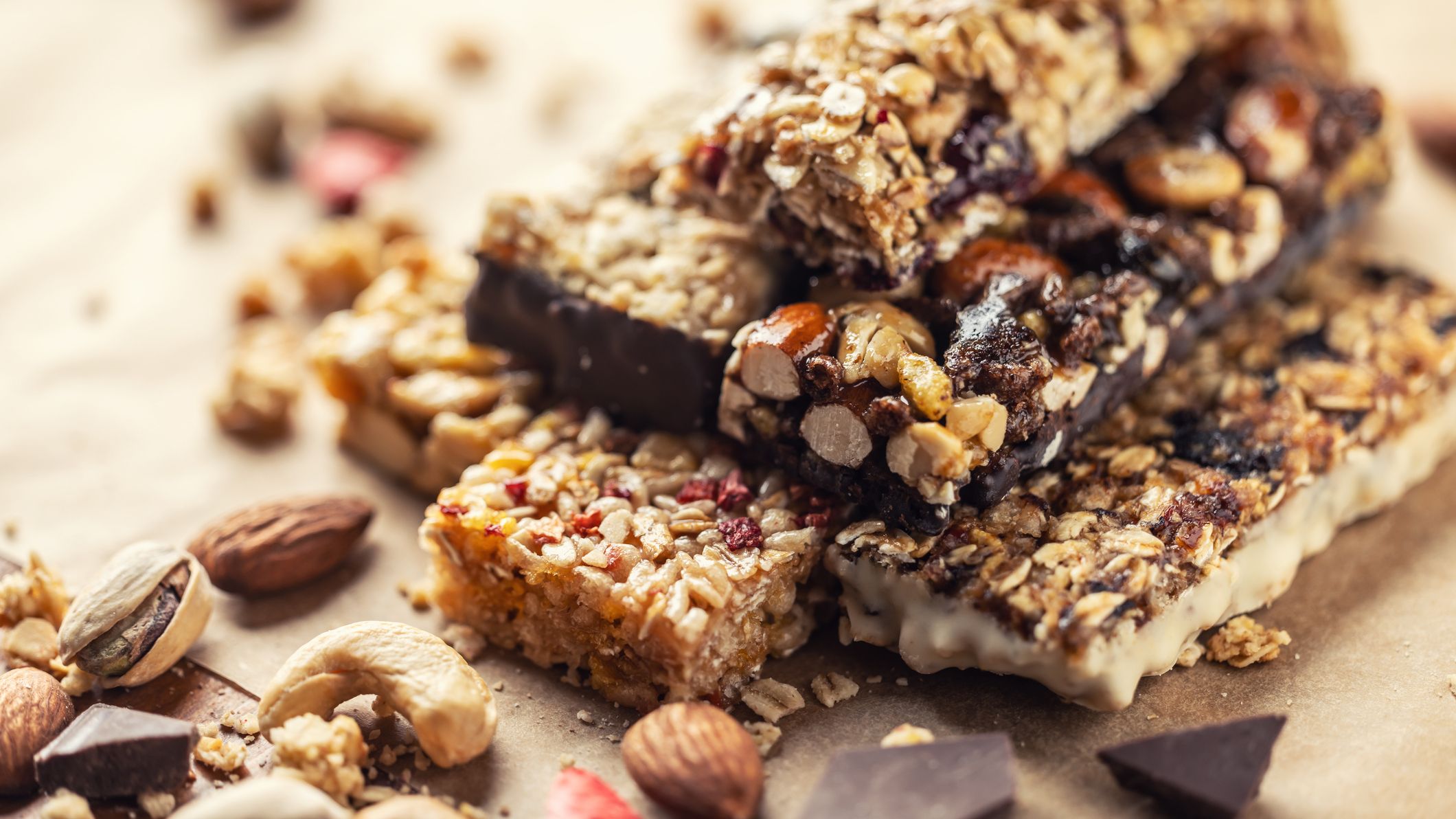 Different Energy protein bars and oatmeal bars on baking paper.