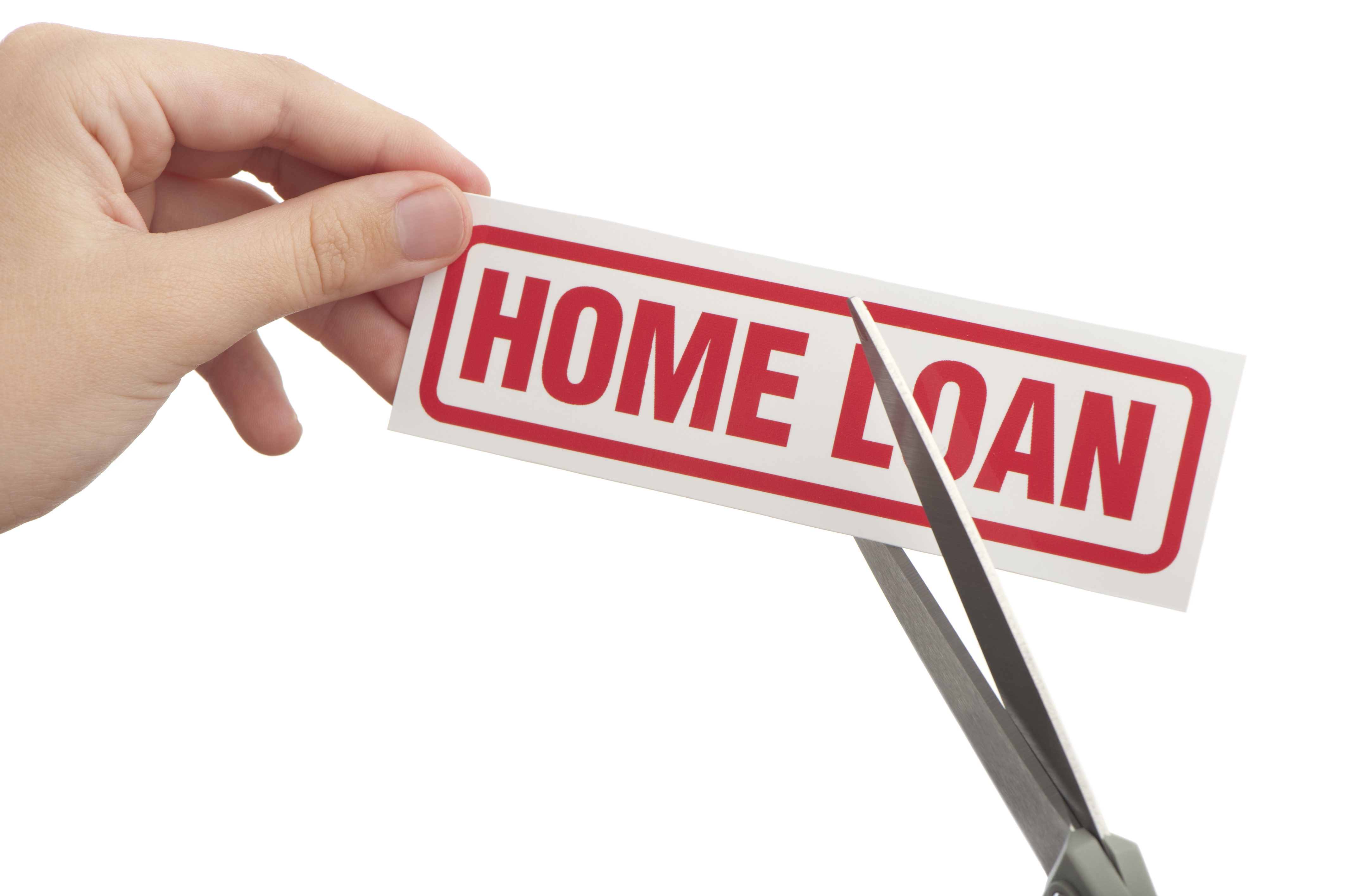 A woman's hand using scissors to cut through the words "home loan."