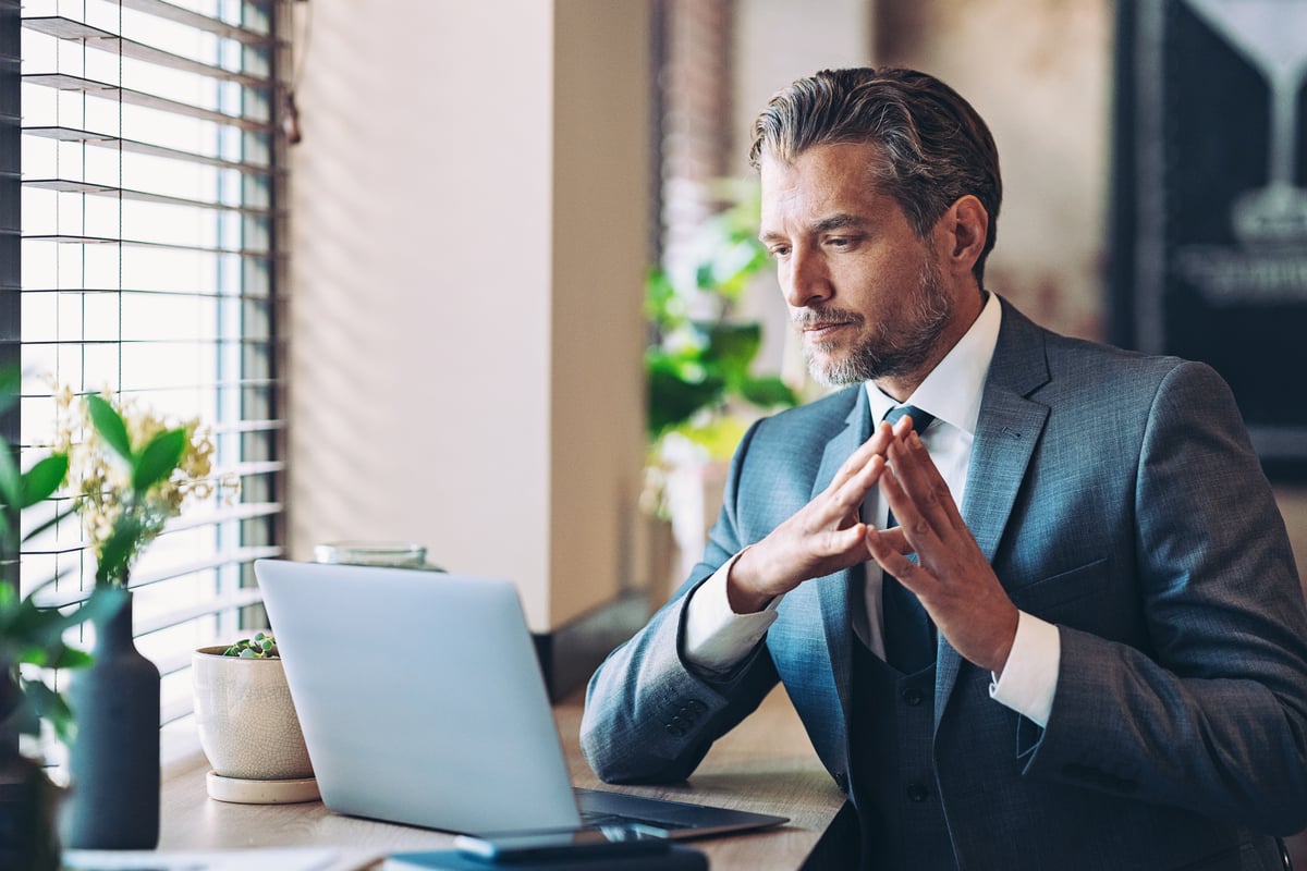 An investor at a desk. 