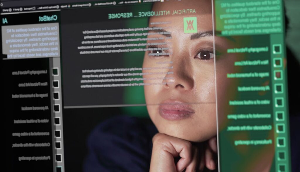 A person staring at a screen, looking at data.