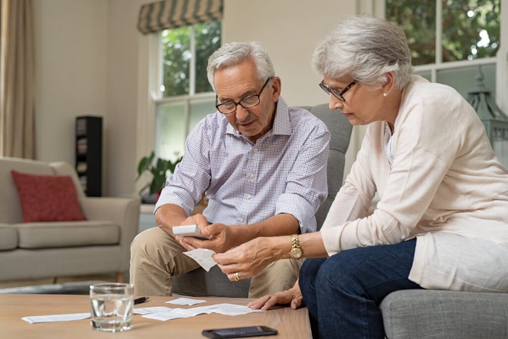 Adults looking at financial paperwork.