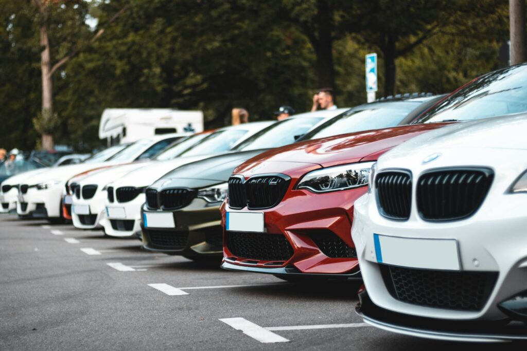 white and red bmw m 3 on road during daytime; cost of car ownership