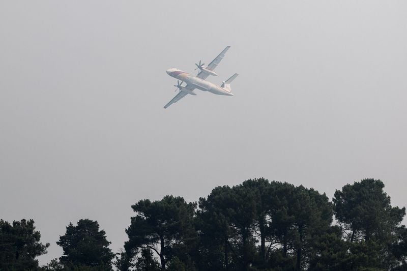 Wildfire rages near Paris as heatwave scorches Europe