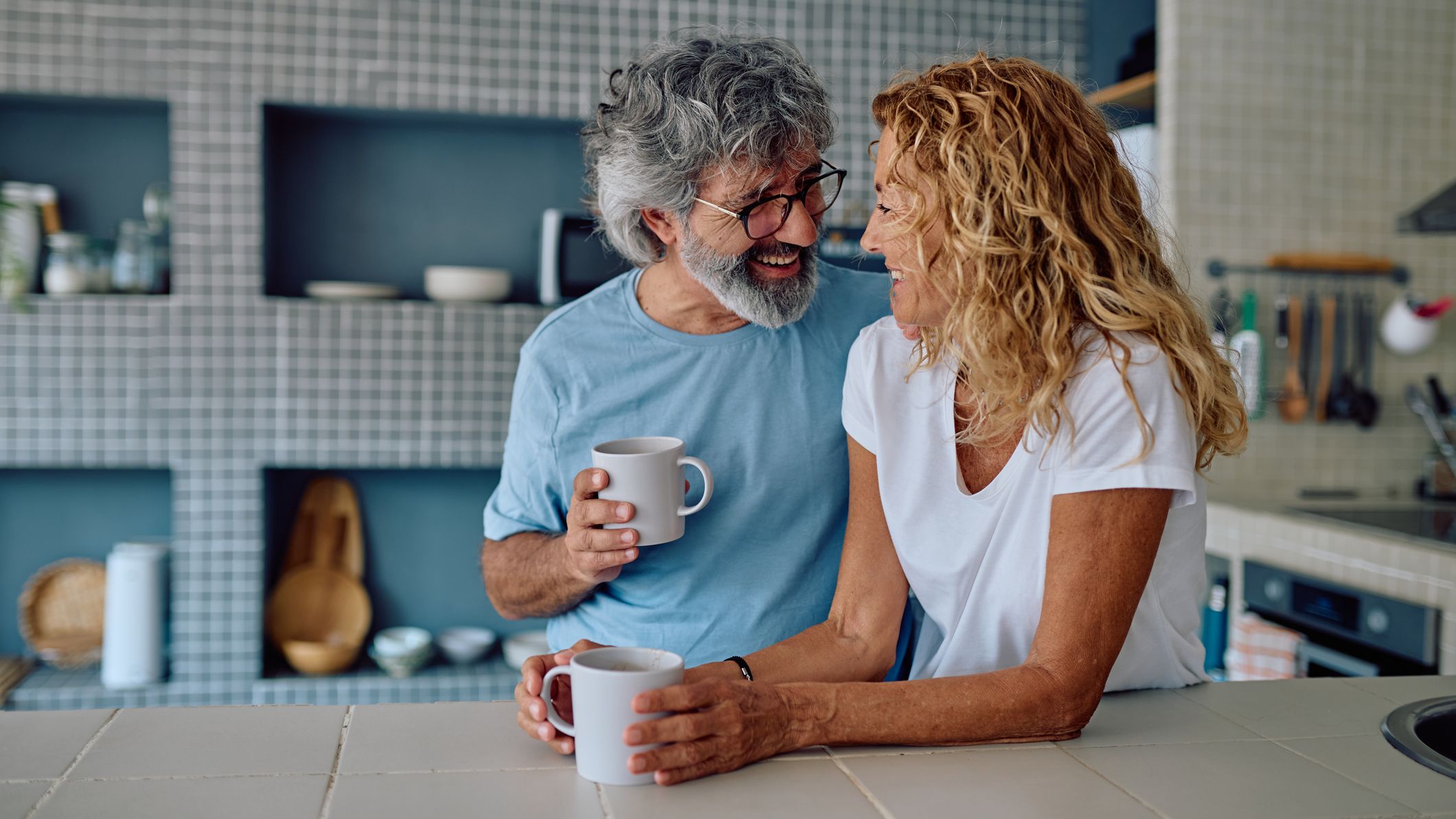 Older couple relaxing in the kitchen