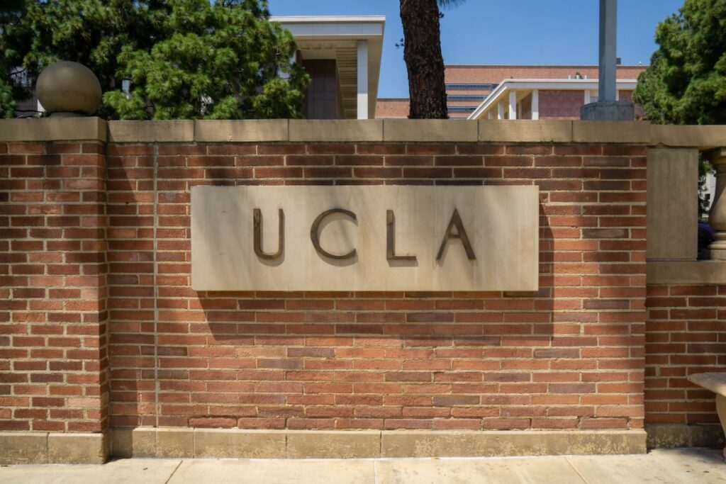 UCLA sign on brick wall