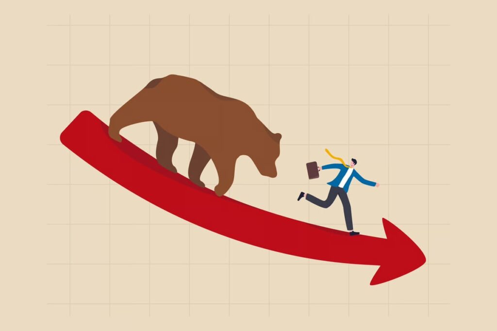 A bull chases an investor down a red arrow.