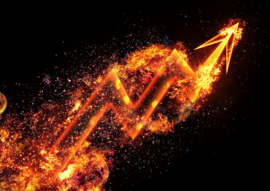 A flaming chart arrow moving up.