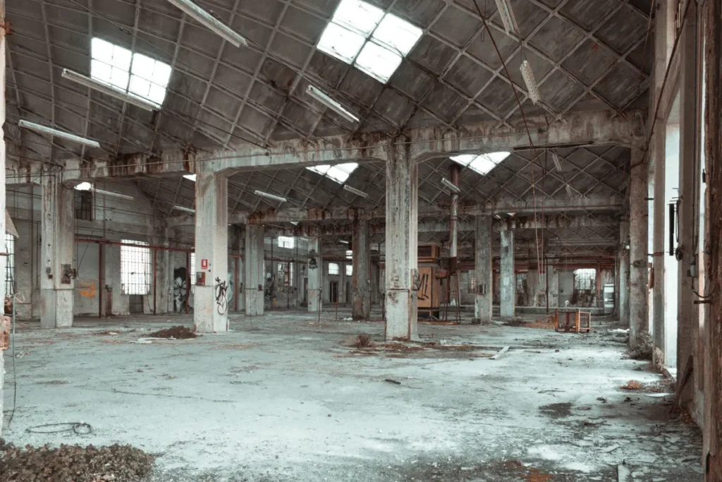 Discover the beauty of an abandoned warehouse interior with columns and derelict features